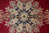 Load image into Gallery viewer, A close-up of a traditional oriental rug featuring a deep red background with a large central medallion in beige, navy blue, and light blue.