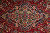 Load image into Gallery viewer, A close-up of an ornate traditional patterned rug with a deep red background and intricate floral motifs in blue, beige, green, and pink.