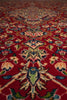 Load image into Gallery viewer, A close-up view of a traditional patterned rug with a deep red background and ornate floral motifs in cream, blue, green, and pink.