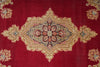 Load image into Gallery viewer, A close-up of a traditional oriental rug featuring a deep red field with a large central diamond medallion and corner motifs in beige, gold, blue, and pink.