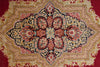 Load image into Gallery viewer, An ornate traditional oriental rug with a large central medallion, featuring a complex floral and scroll pattern in red, beige, navy blue, and gold.