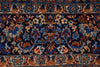 Load image into Gallery viewer, A close-up of an ornate patterned rug with a dark navy blue field, featuring intricate floral motifs in blue, rust red, beige, and cream, framed by decorative borders.