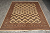 Load image into Gallery viewer, A rectangular area rug with a traditional Persian-style design, featuring a central diamond lattice pattern in beige over a dark brown field, surrounded by a detailed patterned border, laid out on a gray wood floor.