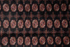 Load image into Gallery viewer, A close-up of a patterned textile featuring repeating ornate medallion motifs in rust red, beige, and black.