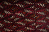 Load image into Gallery viewer, A traditional Persian-style area rug with a deep red field, featuring a repeating diamond pattern in cream, black, and red, and a detailed border, shown laid out on a gray wood floor.