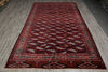 Load image into Gallery viewer, A traditional Persian-style wool rug with a dark red field, cream and black geometric patterns, and a detailed border, laid out on a gray wood floor.