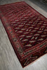 Load image into Gallery viewer, A traditional Persian-style area rug with a deep red field, featuring a repeating diamond pattern in cream, black, and red, and a detailed border.