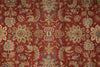 Load image into Gallery viewer, A close-up of an ornate patterned rug with a deep red background and intricate floral motifs in beige, gold, and muted blue.