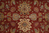 Load image into Gallery viewer, A close-up of a traditional patterned rug with a deep red background and ornate floral motifs in beige, blue, and gold.