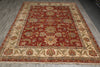 Load image into Gallery viewer, A traditional oriental area rug with a deep red central field, beige borders, and intricate floral motifs in blue, green, and gold, laid out on a gray wood floor.