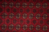 Load image into Gallery viewer, A close-up of a red patterned textile or rug showing repeated circular medallion motifs and dark geometric borders in black, brown, and beige.