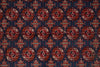 Load image into Gallery viewer, A close-up of a patterned textile or rug showing a repeating medallion motif in red, rust, cream, and dark blue.