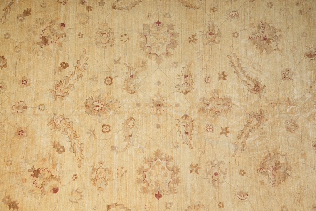 Beige vintage wallpaper with a faded floral and botanical pattern in muted brown and tan tones.