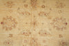 Load image into Gallery viewer, A close-up of a beige and tan patterned rug with a faded floral and medallion design in muted brown and dusty red tones.