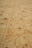 Load image into Gallery viewer, A close-up of a beige and brown patterned rug or textile with woven geometric and floral motifs.