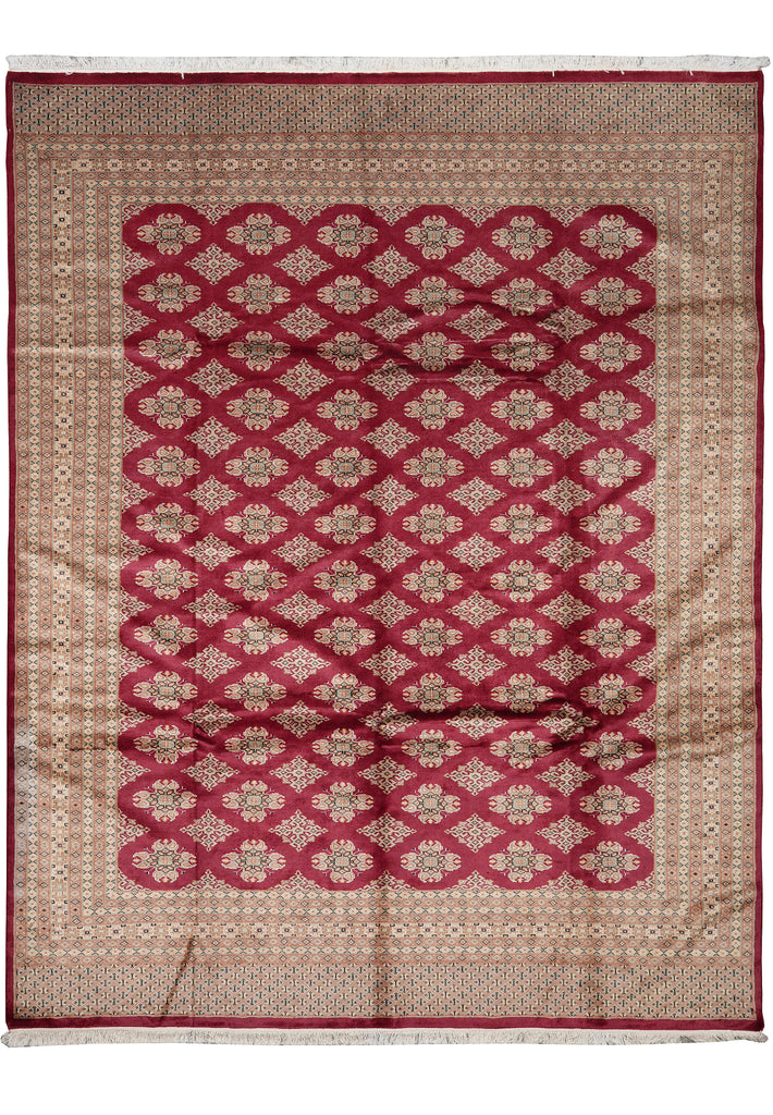 A rectangular area rug with a traditional Persian-style pattern, featuring a central field of deep red geometric medallions on a beige background, surrounded by a matching beige border with red accents.