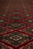 Load image into Gallery viewer, A close-up of a patterned rug or textile with repeating diamond motifs in deep red, black, beige, and muted blue-gray tones.
