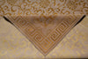 Load image into Gallery viewer, A close-up of a beige fabric bandana or scarf with a Greek key pattern, laid diagonally over a matching patterned fabric background.