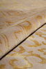 Load image into Gallery viewer, Close-up of a beige fabric with a gold damask pattern, showing the texture and folds of the material.