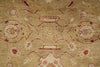 Load image into Gallery viewer, A close-up of a traditional patterned rug with a warm beige background and muted red and cream floral motifs.
