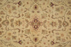Load image into Gallery viewer, A close-up of a traditional patterned rug with a beige background and intricate floral motifs in muted brown, green, and dusty pink.