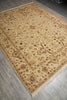 Load image into Gallery viewer, A rectangular area rug with an intricate traditional floral pattern, shown laid out on a gray wood-look floor. The rug has a warm beige base with brown, rust, and muted green details, and features a fringed edge.