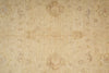 Load image into Gallery viewer, A close-up of a beige fabric or wallpaper pattern with a subtle, faded floral and medallion design in tan, light brown, and soft pink tones.