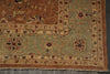 Load image into Gallery viewer, A close-up of an antique-style oriental rug showing its corner, featuring a sage green field, a brown border, and traditional floral motifs.