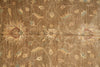 Load image into Gallery viewer, A close-up of a vintage-style floral rug with a distressed, weathered texture. The design features muted beige and tan floral motifs with subtle hints of light blue and reddish-brown accents on a warm brown background.