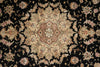 Load image into Gallery viewer, A close-up of an ornate traditional patterned rug with a black background and beige, pink, and green floral medallion motifs.