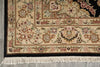 Load image into Gallery viewer, Close-up of an ornate area rug corner showing a cream and beige floral pattern with pink, green, and brown details, a dark border, and white fringe on a gray floor.