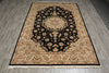 Load image into Gallery viewer, A rectangular traditional area rug with a black central field, beige and cream floral motifs, and a patterned border, shown on a gray wood-look floor.