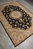 Load image into Gallery viewer, A traditional oriental-style area rug with a black central field, beige floral motifs, and a detailed beige border, shown on a gray wood-look floor.