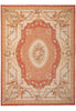 Load image into Gallery viewer, An ornate rectangular area rug with a classic French or French-Italian baroque design. The rug features a central oval medallion and surrounding cartouches filled with floral motifs and classical scrollwork.