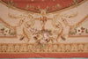 Load image into Gallery viewer, A close-up of a decorative woven textile or rug pattern with floral motifs, scrolling acanthus leaves, and a warm peach and beige palette.