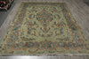 Load image into Gallery viewer, A large traditional oriental area rug with a central medallion and ornate floral border, shown laid out on a gray wood floor.