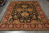Load image into Gallery viewer, A large rectangular area rug with an ornate traditional floral pattern, featuring a black center field, deep red borders, and gold and beige details, laid out on a gray wood floor.