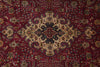 Load image into Gallery viewer, A traditional Persian-style area rug with a deep red background and an intricate central medallion pattern in beige, navy, and gold.