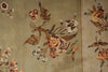 Load image into Gallery viewer, Close-up of a woven textile or rug with a floral pattern on a muted beige background, featuring flowers and leaves in tan, brown, pink, cream, and small blue accents.