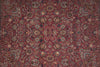 Load image into Gallery viewer, An ornate traditional oriental rug with a dense floral and vine pattern in deep red, burgundy, beige, and navy blue.