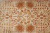 Load image into Gallery viewer, A close-up of a woven textile or rug pattern with a cream background and rust-brown floral motifs, including sunflower-like centers and small blossoms arranged in a repeating design.