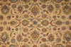 Load image into Gallery viewer, A close-up of an ornate floral patterned rug or textile with a warm beige background and repeating medallion motifs in muted blue, brown, green, and rust tones.