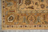 Load image into Gallery viewer, A close-up of an ornate traditional area rug corner, showing a warm beige and gold base with intricate floral and medallion motifs in muted blue, green, brown, and rust tones.