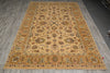 Load image into Gallery viewer, A large rectangular area rug with an intricate traditional floral and medallion pattern, laid out on a gray wood-plank floor.