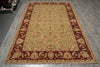 Load image into Gallery viewer, A rectangular traditional area rug with an ornate floral pattern, featuring a golden-yellow center field and a deep red border, displayed on a gray wood-look floor.