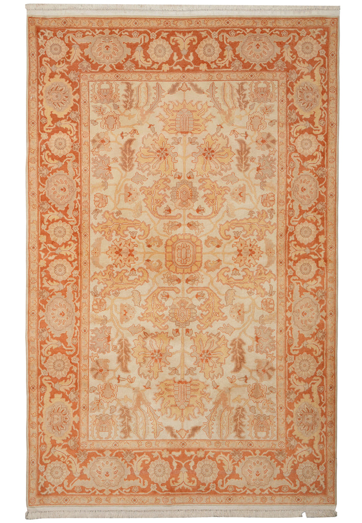 A traditional oriental-style area rug with an intricate floral and medallion pattern in warm orange and beige tones, shown flat against a white background.