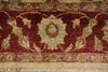 Load image into Gallery viewer, Close-up of an ornate patterned rug with a deep red field, cream and beige floral motifs, and a fringed edge.
