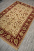 Load image into Gallery viewer, A rectangular area rug with an intricate floral and vine pattern, featuring a beige center field and deep red borders, laid out on a gray wood-look floor.