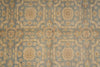 Load image into Gallery viewer, A close-up of a vintage-style patterned textile or wallpaper featuring a muted blue-gray background with beige and tan floral motifs and geometric borders.