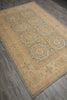 Load image into Gallery viewer, A rectangular area rug with a traditional medallion pattern in beige, muted blue, and tan, shown laid out on a gray wood-look floor.
